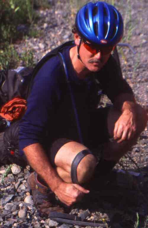 Rick repairing tire.
