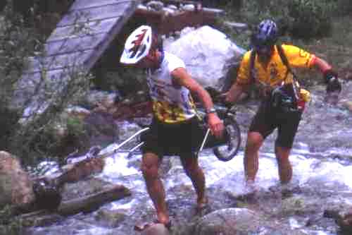 Crossing creek beside broken bridge near east trailhead.